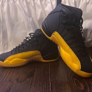 Black and yellow Jordan 12s
